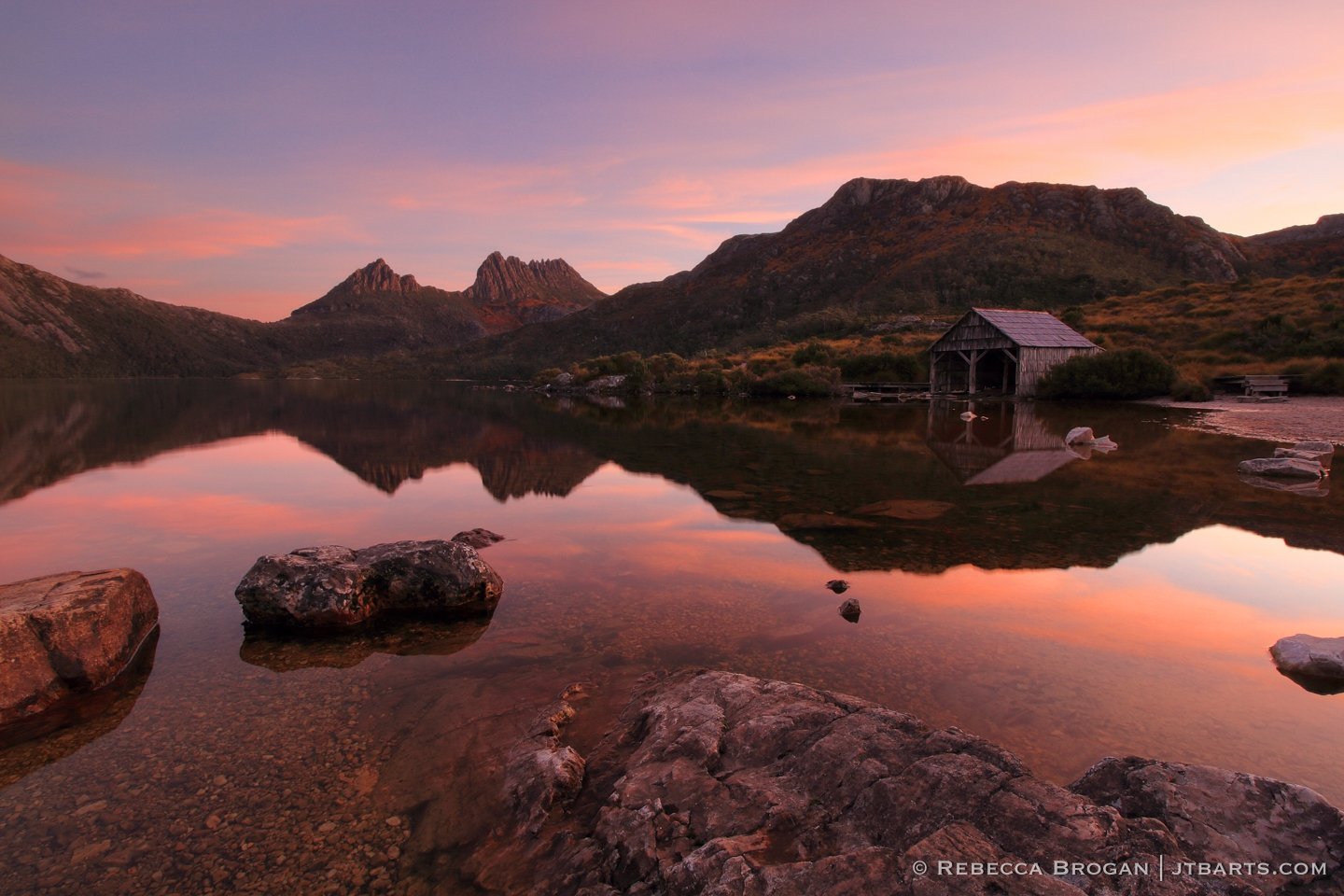 Cradle Mountain Dove Lake Sunset Reflection with boathouse, boat shed. Cradle Mountain - Lake St. Clair National Park, Tasmania.