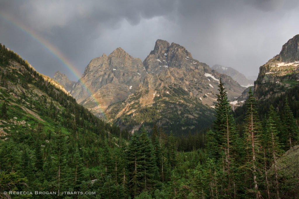 Grand Teton and Mt Owen thunderstorm and rainbow panorama landscape photograph taken from North Fork Camping Zone in Grand Teton National Park. Wilderness Photographer: Rebecca Brogan www.jtbarts.com