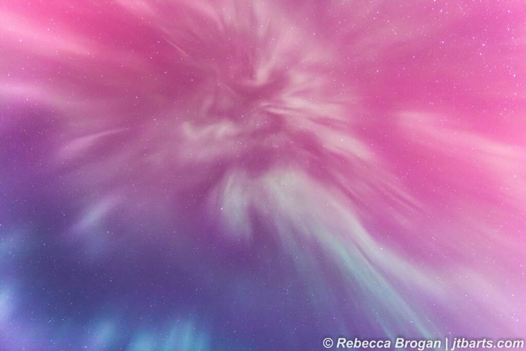 Aurora Australis corona over Hobart, Tasmania, Australia with pink, purple and blue aurora colours