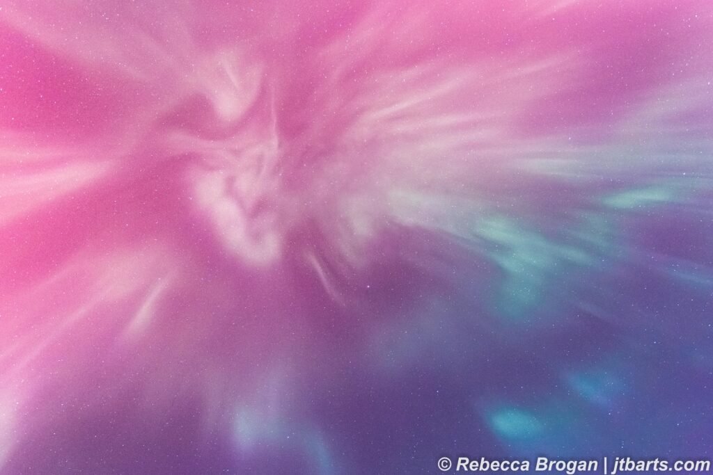 Aurora Australis corona photograph from Hobart, Tasmania, Australia, with pink, purple and blue aurora colours.